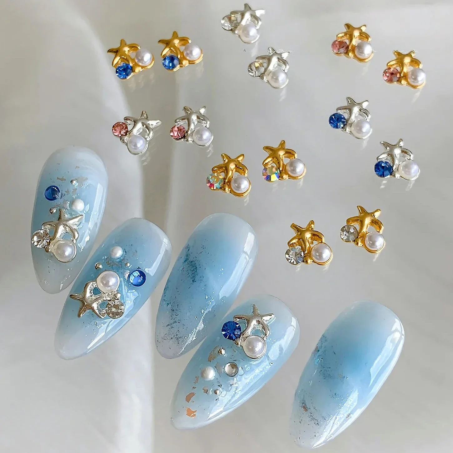 Exquisito y bonito corona de perlas de concha, estrella de mar, diamantes de imitación de Metal, joyería de aleación para playa y mar, accesorios para decoración de uñas