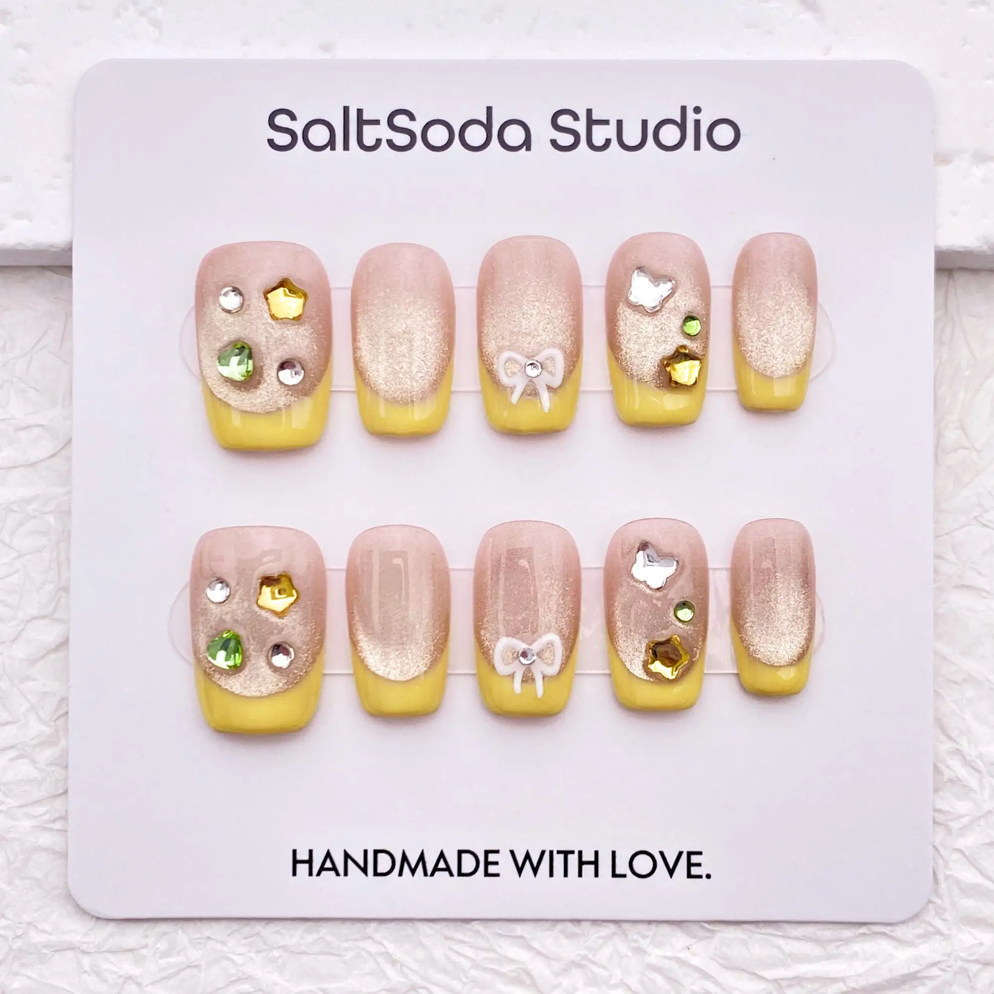 

Cute crystal bow nail art, glitter light pink cat eye hand-pressed nail art, high-quality reusable nail art
