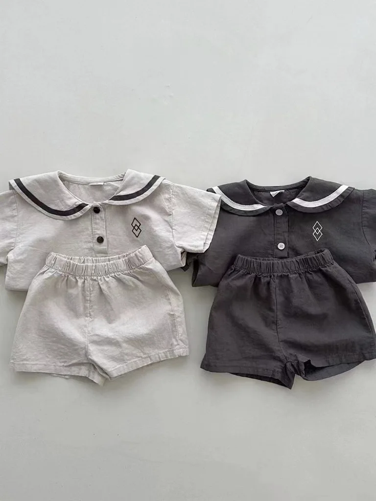 Conjunto de ropa de manga corta para bebé, pantalones cortos informales para niño y niña, traje de cuello azul marino con patrones geométricos,