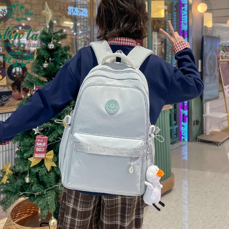 zaino-traveasy-2026-nuovo-colore-solido-minimalista-per-studenti-in-nylon-grande-capacita-con-ciondolo-a-forma-di-anatra-casual-per-campus