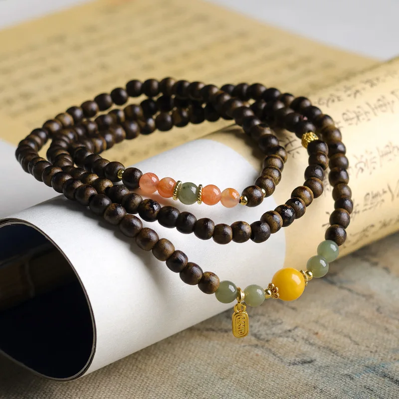 Original design multi-strand bracelet featuring butter-colored agarwood natural beeswax South Red Agate and Hetian jade