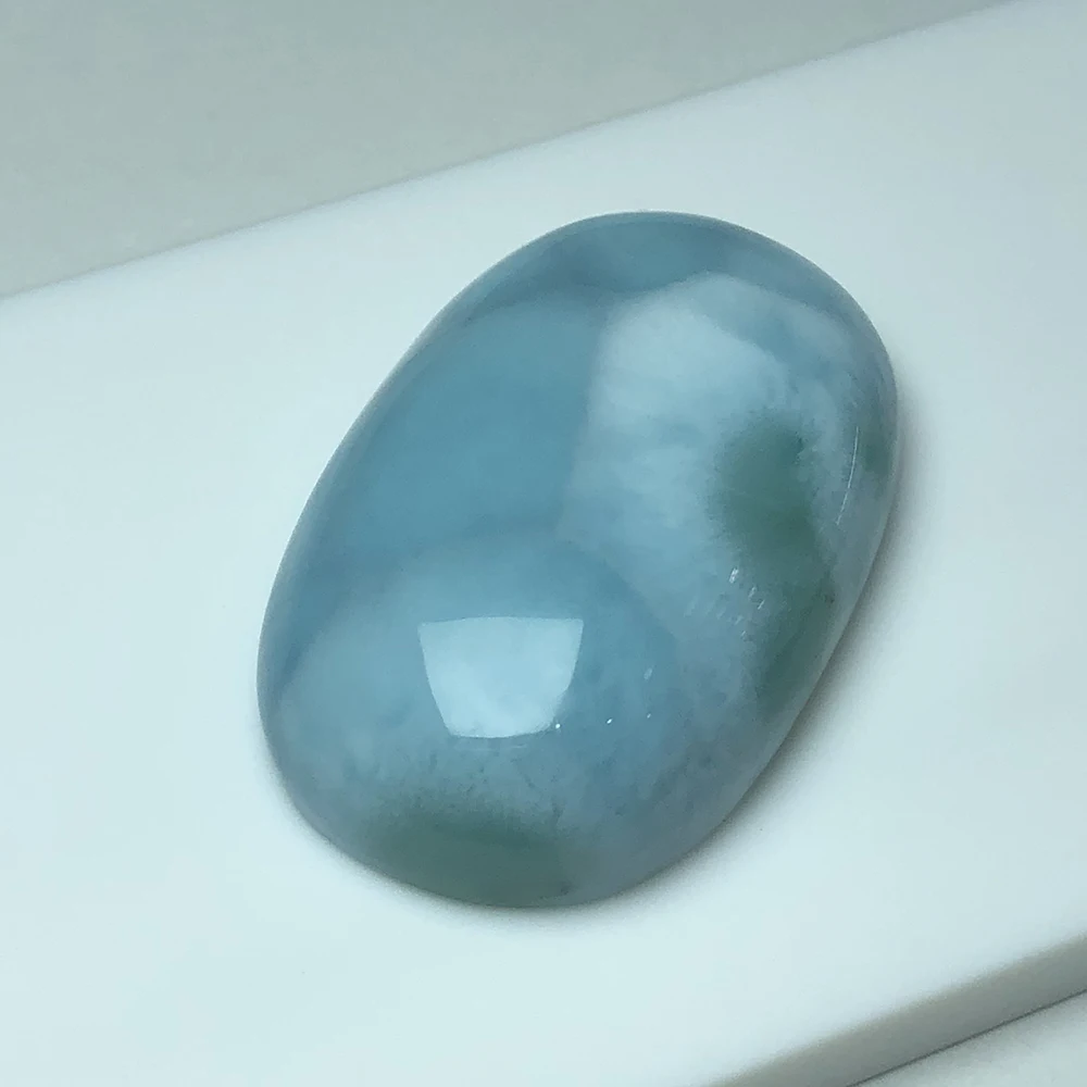 

Natural blue larimar stone, oval 31.5mm*20mm,14.04 gram, beautiful blue color, rare collection, pure and clean