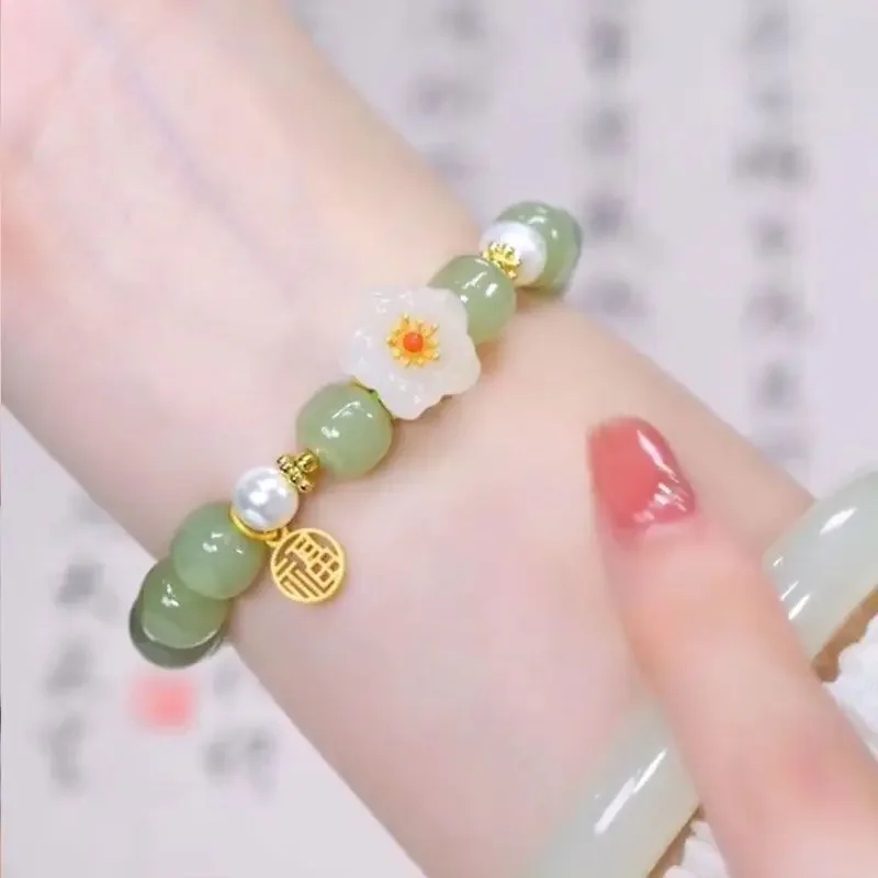 

UMQ Natural Hotan Jade Small Peach Blossom Bracelet for Women's 2024 New Fashionable Niche Design Luxury HandString Gift Jewelry