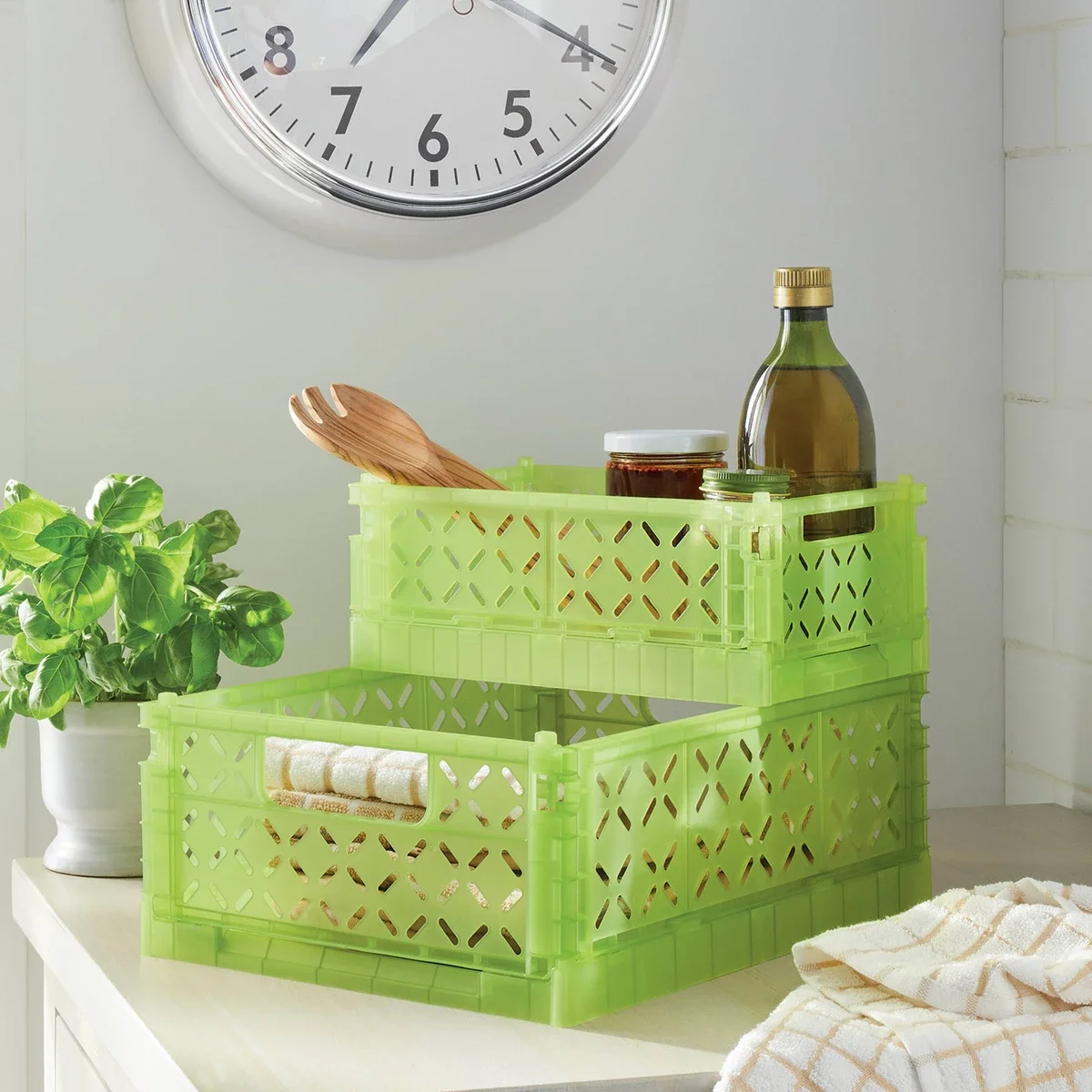 

Foldable Crate Small Green Small foldable crate in green Cut-out cross pattern Open-top design Cutout handles Folds flat