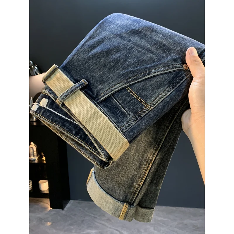 جينز جديد غير رسمي بجيب مائل لعام 2025 للرجال، سروال خريفي متعدد الاستخدامات وقصة ضيقة وتنحيف مدبب بأرجل صغيرة