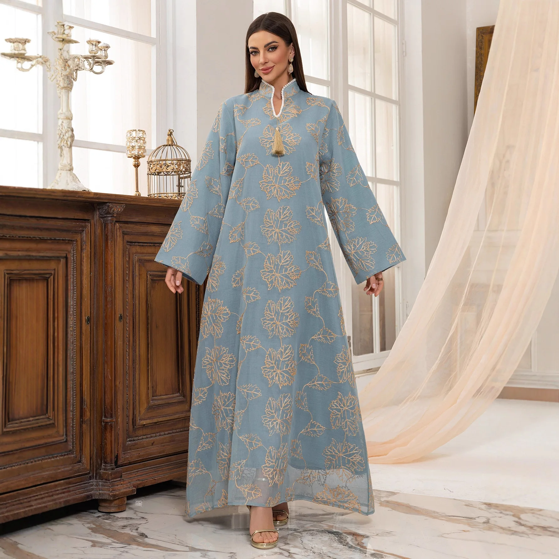 

Abaya Muslim Light Embellished with Golden Leaf Tassel Adornment for Daily Wear and Festive Occasions in Islamic Communities