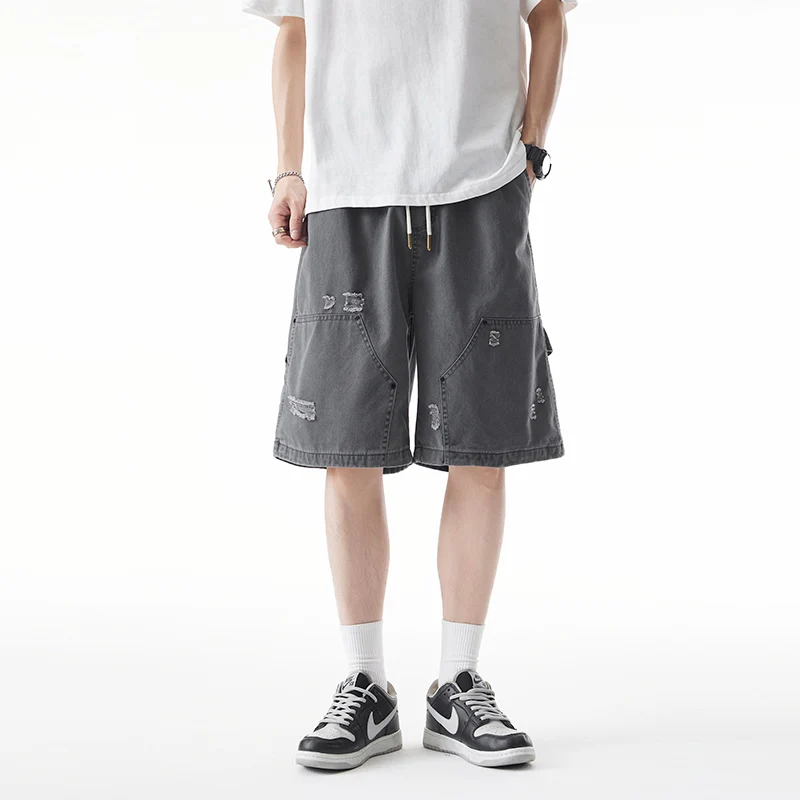 

Новые мужские летние брюки 2025 года для активного отдыха, американский дизайн с элементами пэчворка, рабочие брюки средней длины с рваными элементами, брюки-капри.