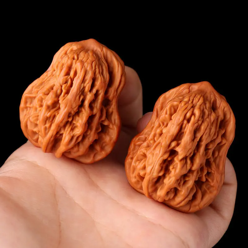 Hand-held walnut ornaments: eagle-beak, official hat, lantern, wheat stalk, tiger head, peanut, uniquely shaped small gourd, lio