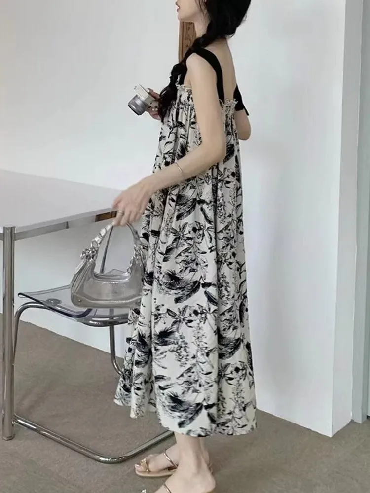 ชุดเดรสยาวทรงเอไลน์ผ้าชีฟองพิมพ์ลายดอกไม้สีน้ำ สไตล์ลำลองสำหรับฤดูร้อน เหมาะสำหรับใส่ไปเที่ยวชายหาด ช่วยพรางหุ่นให้ดูเพรียวบาง
