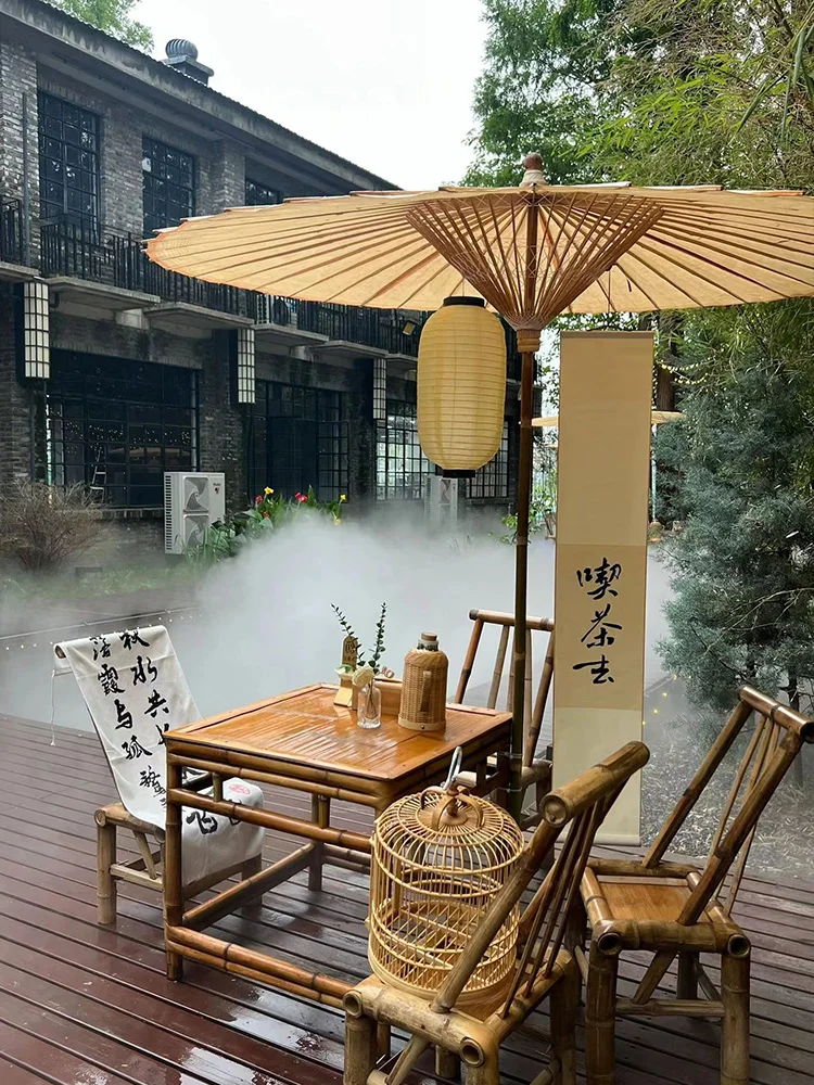 A combination of bamboo tables and chairs for brewing tea in a furnace, outdoor courtyard bamboo tables, Chinese retro style