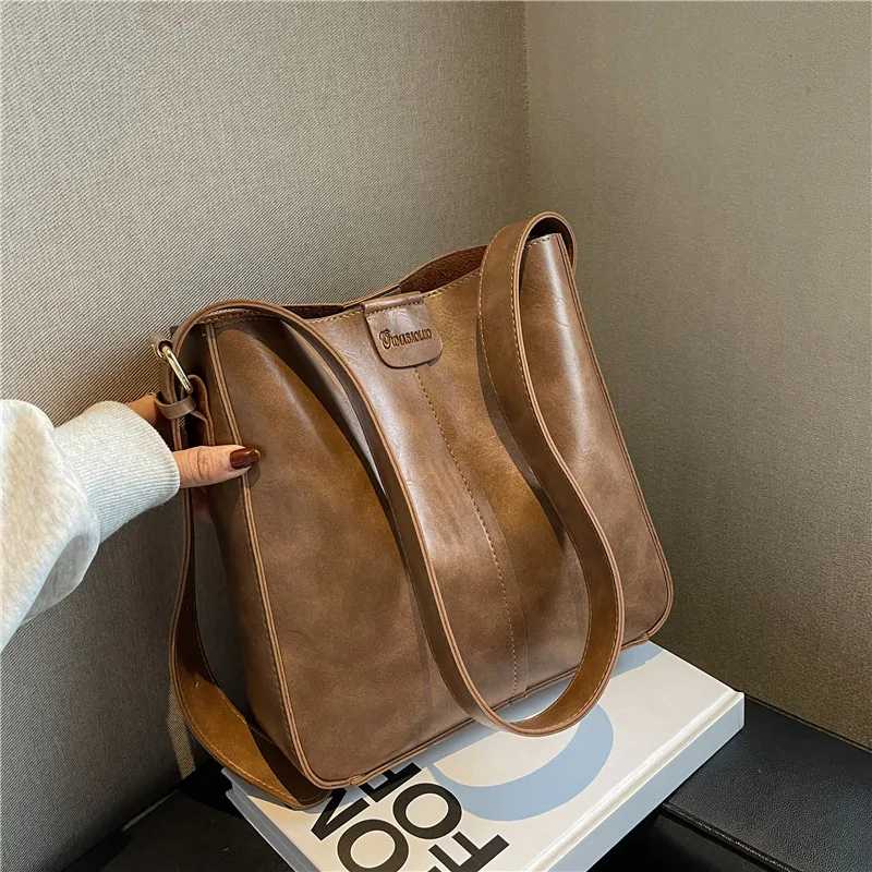 Sac à main en cuir PU pour femme, grande capacité, sac à bandoulière portable, sac à main à une seule initiative, tendance féminine, E27