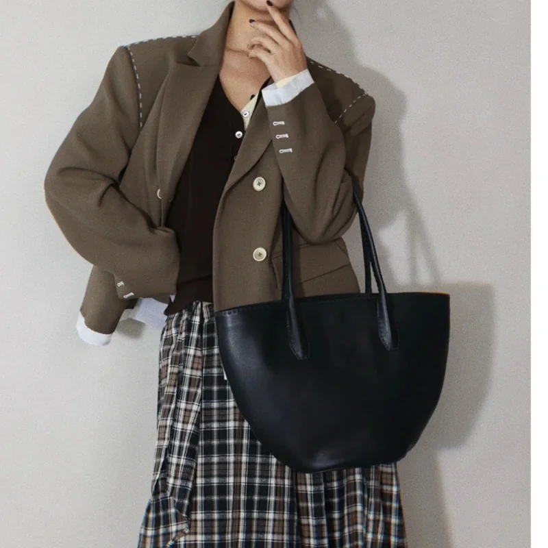 

Ladies' full grain cowhide handmade hand sewn overall curved handbag tote bag