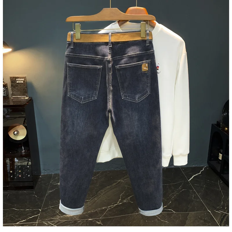 Primavera e outono novos jeans masculinos na moda versátil moda cinto estilo pequeno pé elástico casual haren tendência high-end