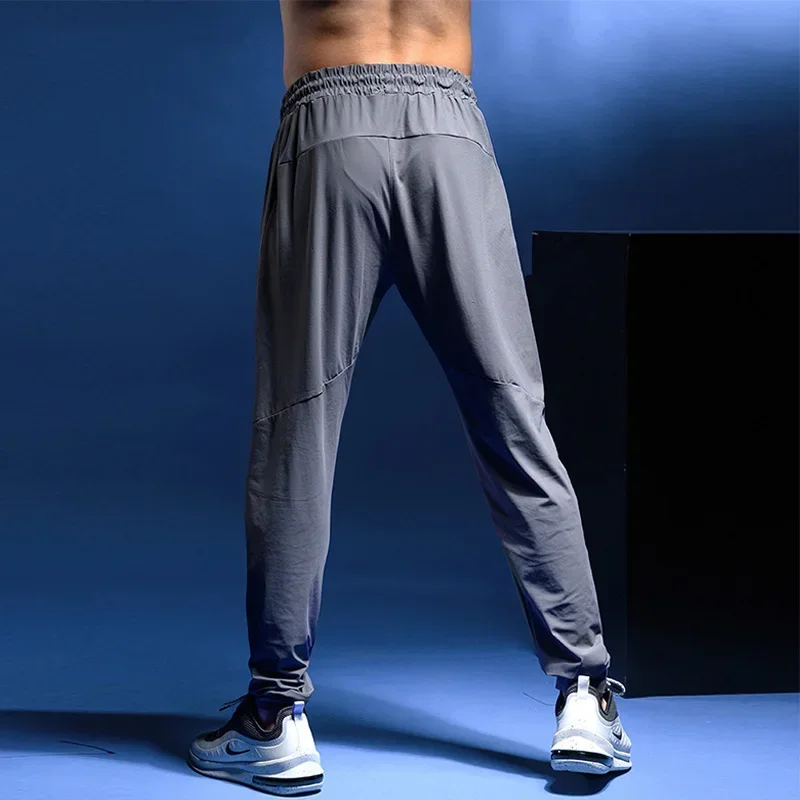 

Men's Sports Running Pants Jogging Training Elastic Cylinder Active Gym Workout Jogging Trousers Sweatpants Ropa Deportiva