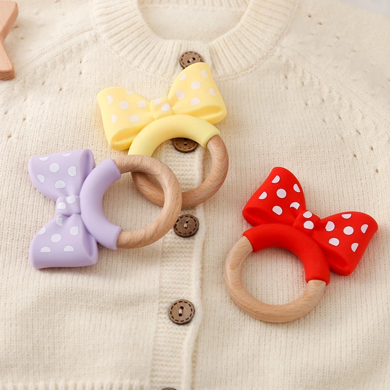 

Baby Silicone Teether Toys Food Grade Silicone Bow Wooden Ring Bracelet Teething Toys For Baby Soothing Tooth Chew Teething Toys