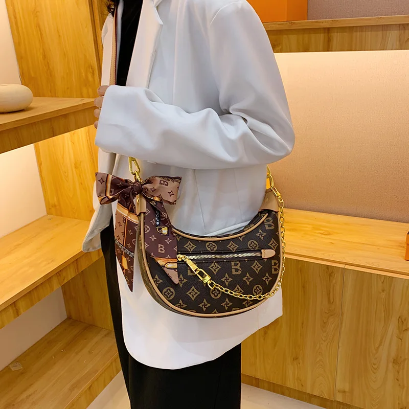 

Новая женская сумка через плечо 2026 года: высококачественная текстура, тщательно разработанная известными дизайнерами из экологически чистой кожи