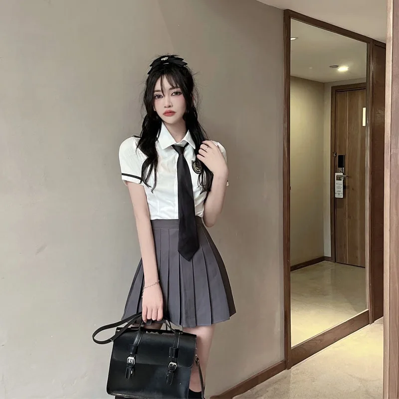 Bianco ort Sve irt e gonna a pieghe JK orm Set due pezzi Preppy School orm Sle Faionable Ensemble da donna