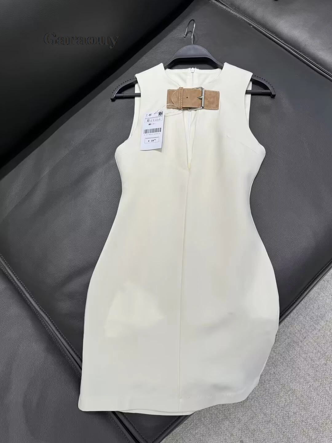 Garaouy Woman Sleeveless Back Zipper White Slim Short Dress Female Elegant Sexy Hollow Out O Neck Leather Buckle Chic Mini Dress