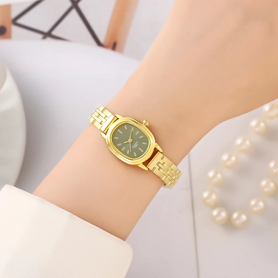 ساعة يد كوارتز عتيقة جديدة بمزاج عصري ومؤشر قرص بيضاوي وحزام فولاذي رقمي بسيط للسيدات