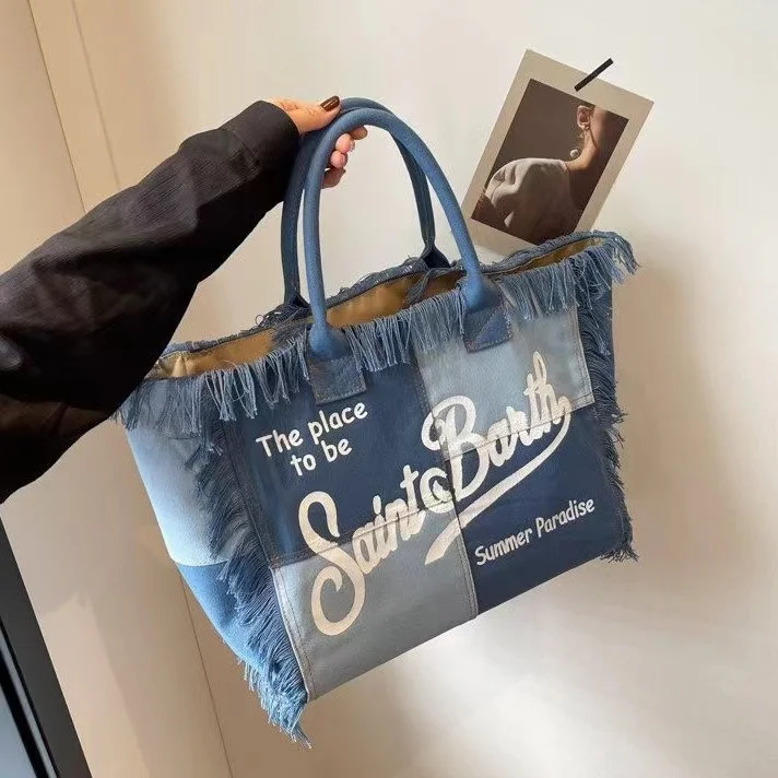 Bolso de diseñador de lujo con borla de letras, bolsa de lona de gran capacidad, Simple, para viaje, estudiante, playa, hombro, estampado vaquero, novedad de 2024