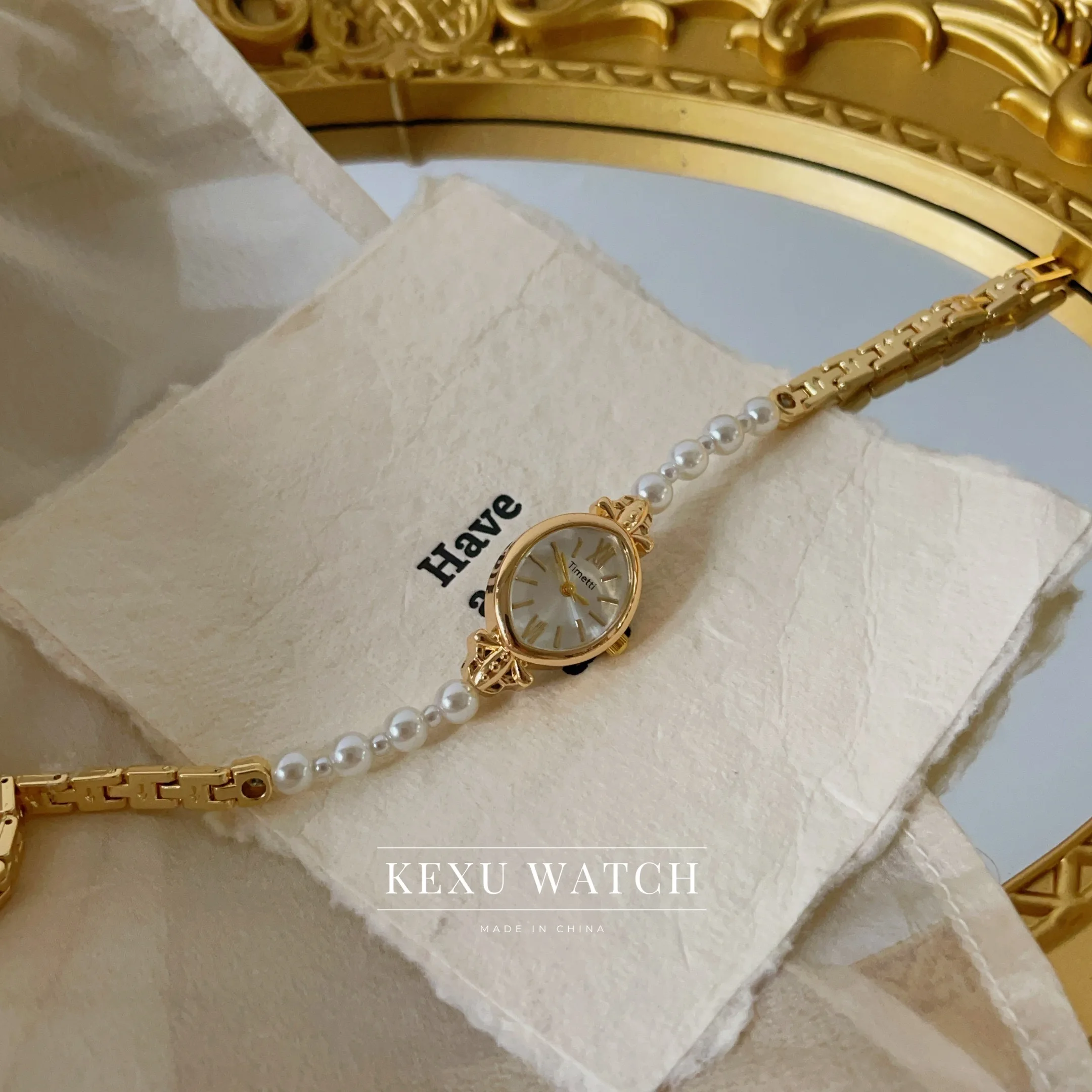 ساعة تيميتي للنساء، ساعة نسائية بسوار من اللؤلؤ مستوحاة من الطراز القديم، ساعة نسائية على الموضة ذات وجه بيضاوي للبيع بالجملة