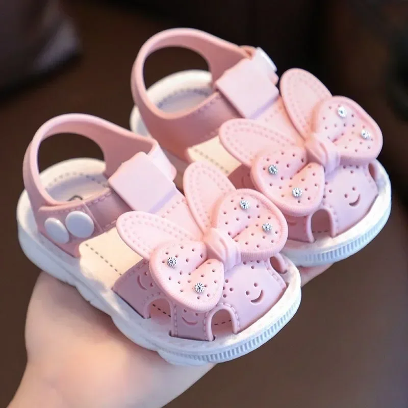 Scarpe estive per bambini con fiocco solido Sandali antiscivolo da spiaggia in PVC carino per neonate Calzature Sandali morbidi per bambini alla moda