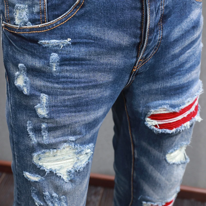 

newY2K jeans with red patches, pleats, washed with water, nostalgic stretch, repaired with blue, designer high street h
