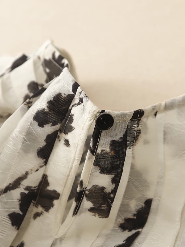 قميص نسائي صيفي جديد 2025 بدون أكمام بياقة دائرية وتصميم فني بالحبر، فضفاض وقصير، يمنح مظهراً نحيفاً، مناسب للارتداء اليومي