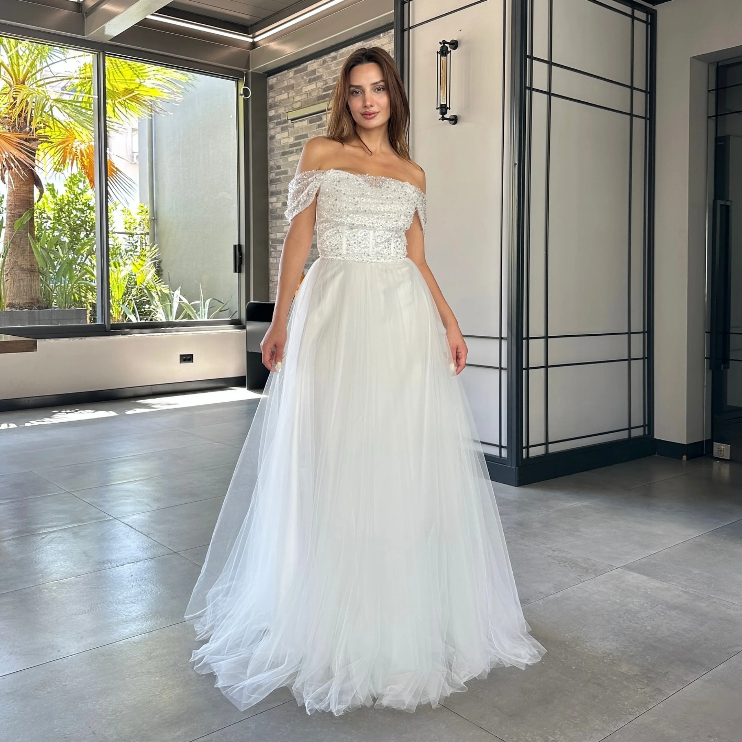 فساتين لحضور الحفلات الموسيقية باللون الأبيض الكلاسيكي للنساء بدون أكتاف ترتر فيستدوس دي غالا لعام 2025 ثنيات مخصصة للفتيات فساتين سهرة من التل #1