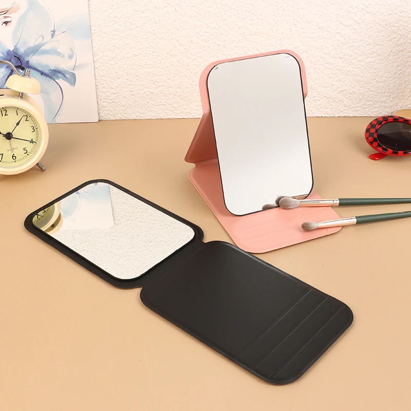 เดสก์ท็อปแต่งหน้ากระจกหนัง PU กระจกโต๊ะเครื่องแป้งแบบพกพากระจกมือพับได้กระจกขนาดกะทัดรัดน่ารักกระจกกระเป๋าสําหรับเครื่องมือการเดินทาง