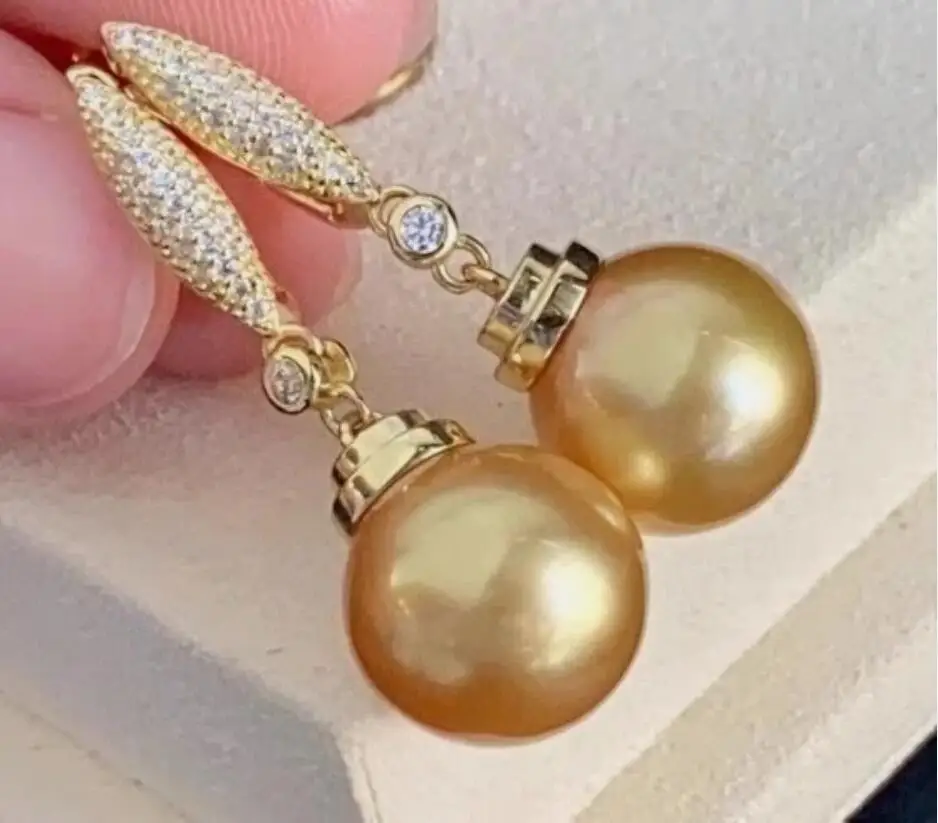 

Потрясающие круглые серьги AAAA с натуральным золотым жемчугом Южных морей диаметром 10–11 мм, 925 пробы.