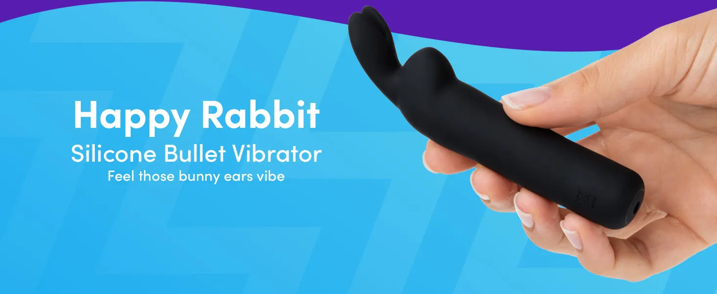 Black silicone bullet vibrator named 'Happy Rabbit' held in a hand, featuring a curved shape with rabbit ear-like protrusions at one end.