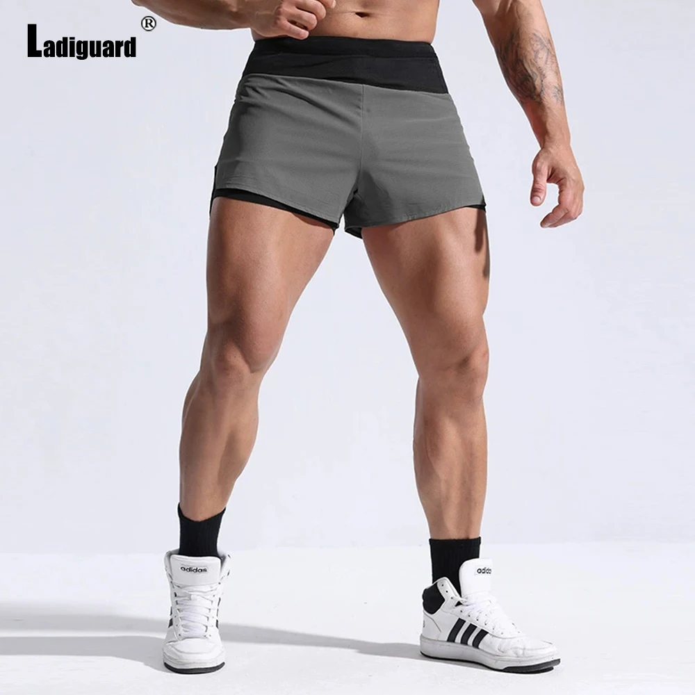 

2026 New Summer Casual Running Shorts Men Sexy Elastic Wiast Ultra-shorts Male Stand Pockets Casual Patchwork Short Pants Hommes
