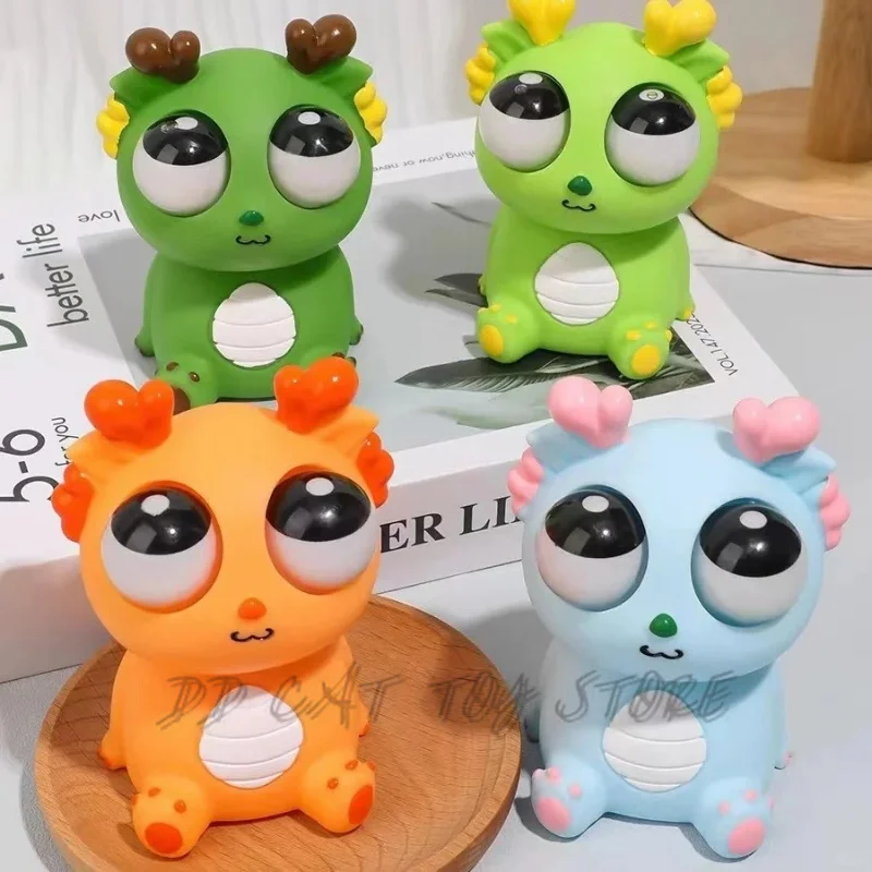 Drago dell'occhio esplosivo da 2 dollari Giocattolo sensoriale pop-up creativo Giocattolo di decompressione del dinosauro Spremere il giocattolo divertente dell'occhio stellare