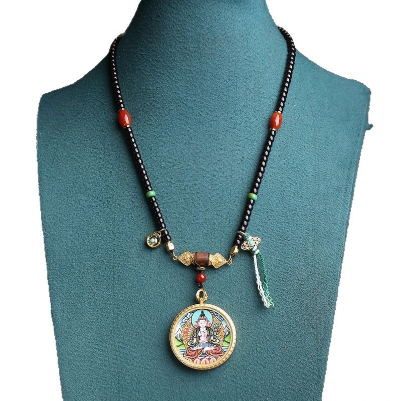 Tibetan-style collectible, hand-painted thangka pendant featuring the Bodhisattva Mahāsthāmaprāpta, with a red agate and coconut