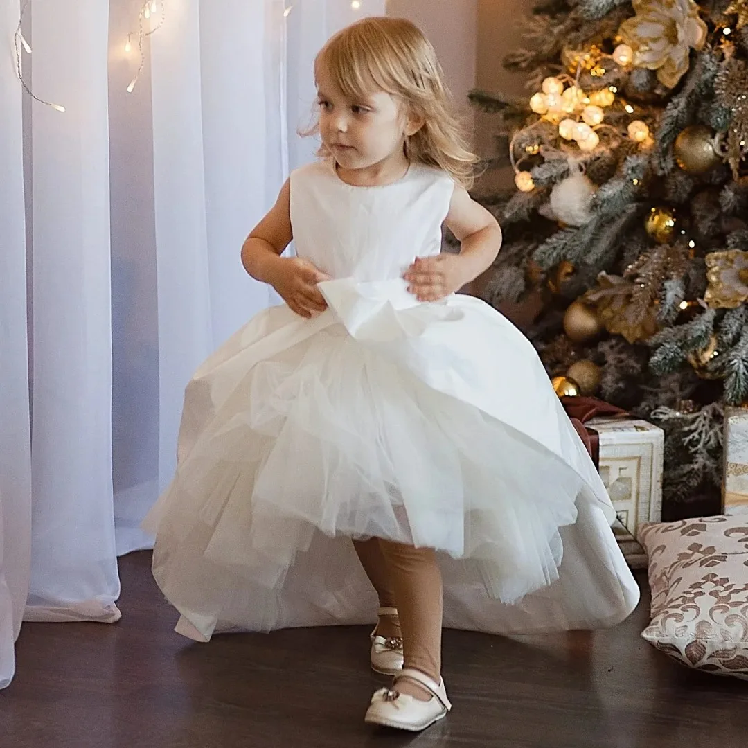 Custom Flower Girl Dress White Tulle and Satin with Bow, High-Low Design Suitable for Weddings, Birthday Parties, and Communion