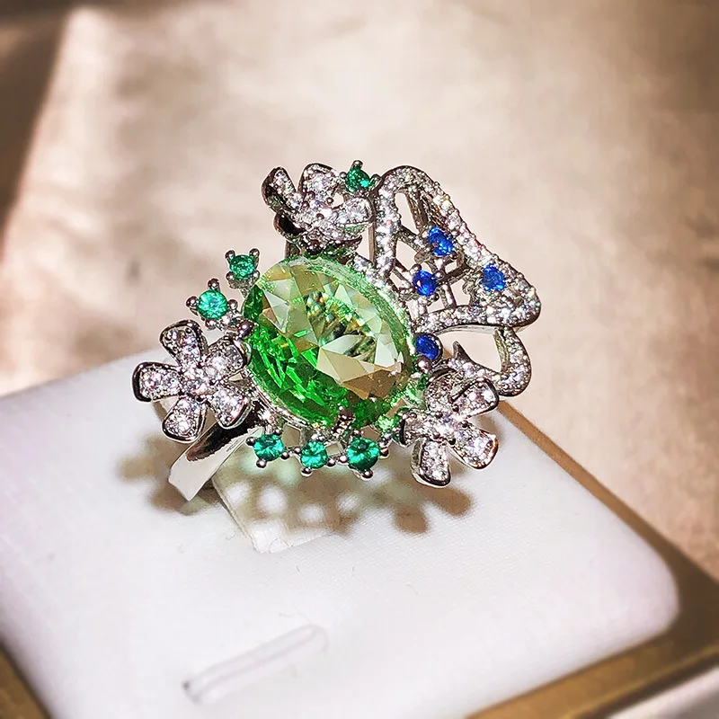 Neue kleine frische Blume oval grün Zirkon Ring für Frauen Silber Ausschnitt Schmuck Hochzeits göttin Festival Geschenk