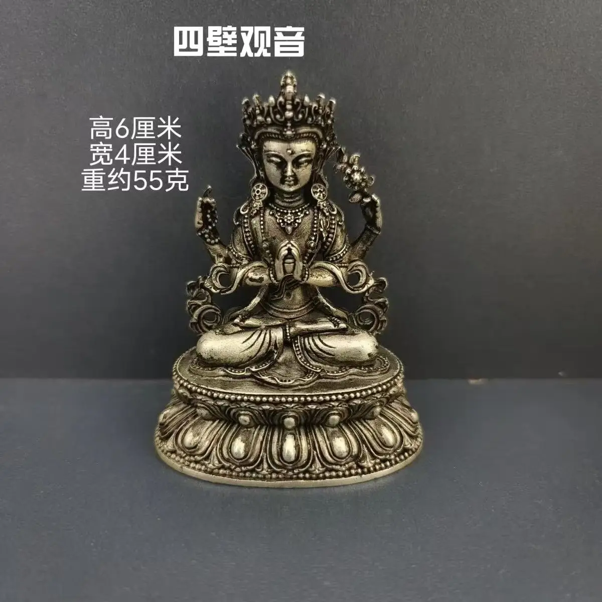 

Tibetan-style two-inch portable Buddhist Tibetan-style white bronze and silver Nepalese Buddha statue offering four-armed Guanyi