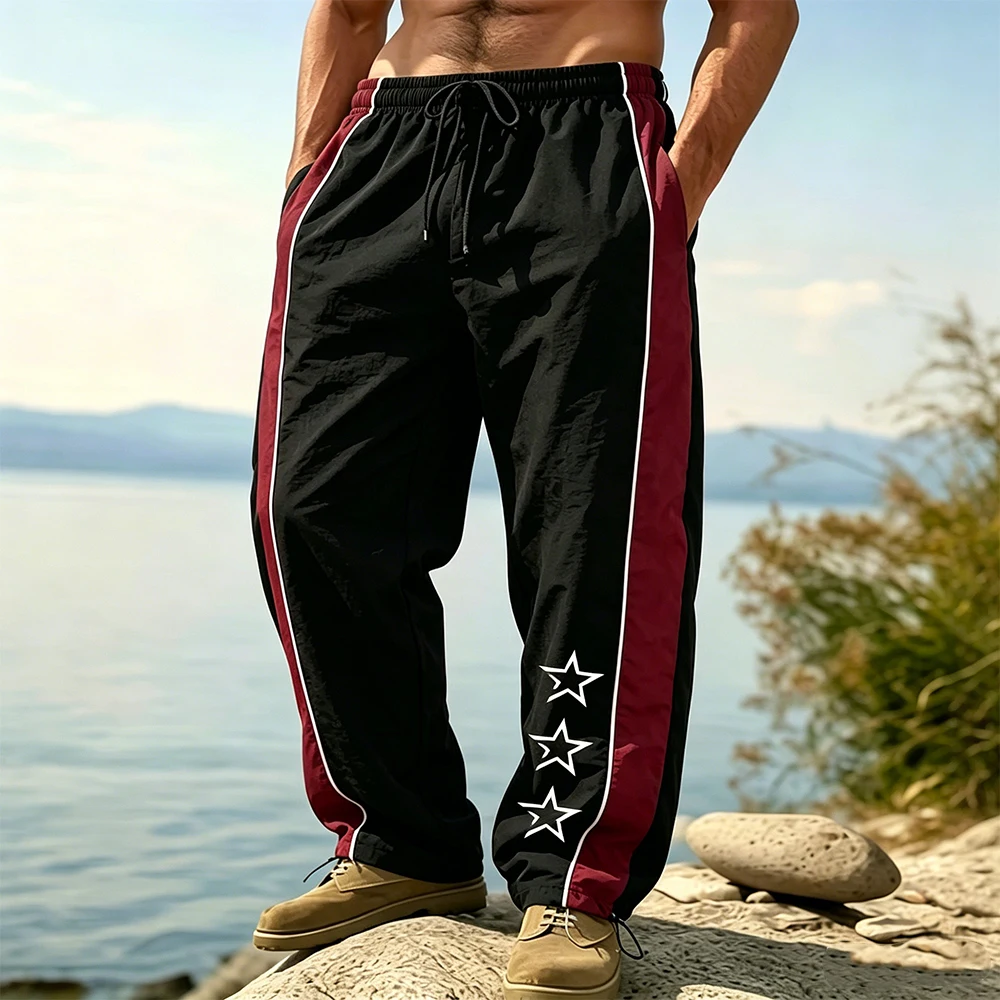 

Men's Casual Side Stripe Track Pants Quick Dry Loose Fit Drawstring Elastic Waist Hollow Star Print with Adjustable Ankle Cuffs