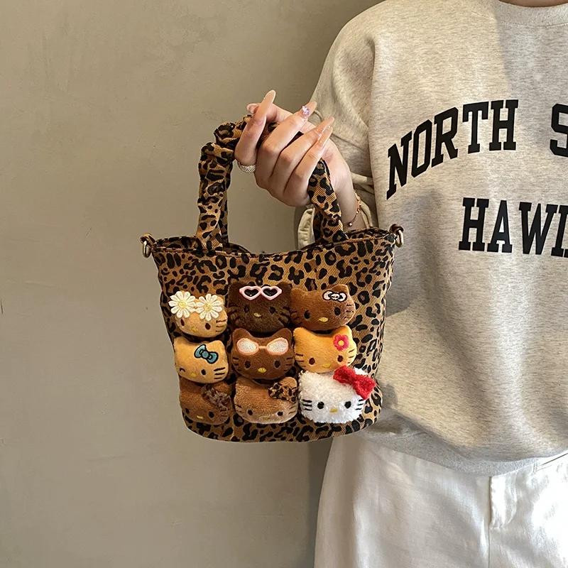 여성을위한 Hellokitty 핸드 헬드 버킷 백 가을 겨울에 다재다능한 대용량 부드럽고 독특한 크로스 바디 백 귀여운 작은 가방
