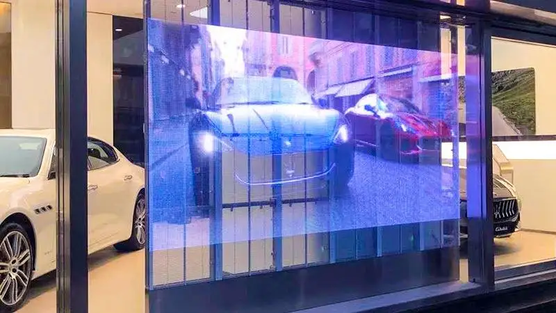 Showroom Highlight P3.91 Indoor Vivid Transparent LED Glass Window Display Crystal-Clear State-of-the-Art Dynamic Ad Panels