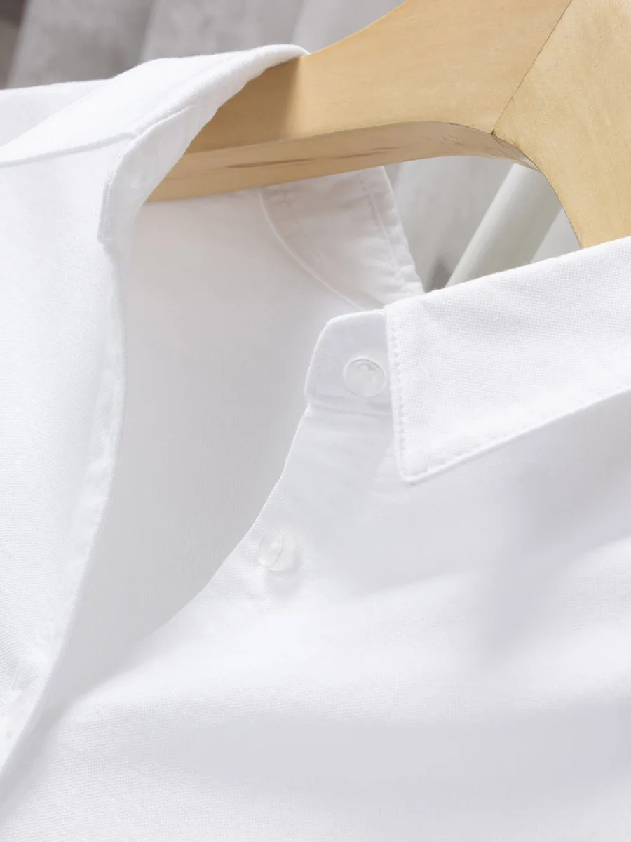 Camicia bianca di media lunghezza da donna in puro cotone Oxford sciolto alla moda e versatile sottile di buona qualità