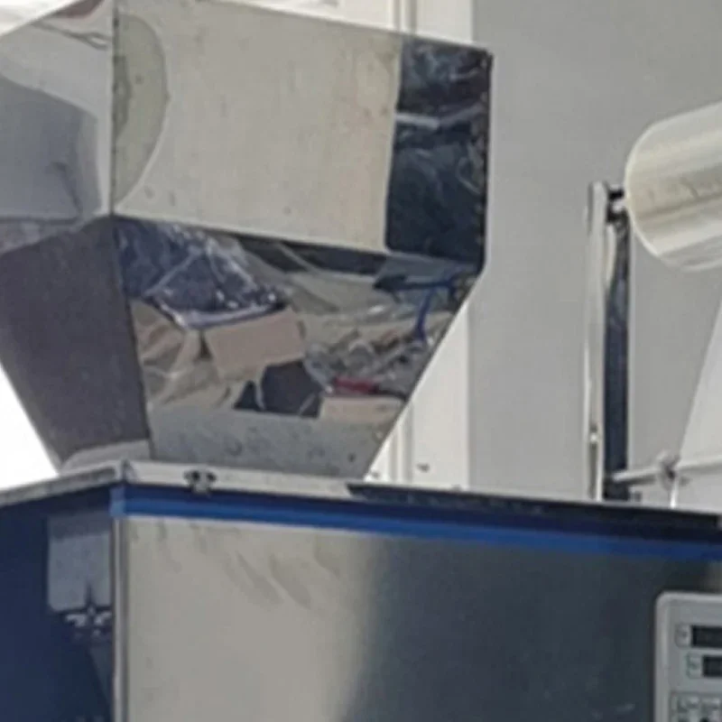 Granule Seed Packaging Machine Flour Seasoning Filling Packaging Machine 1-100g Weighing and Measuring Packaging Machine