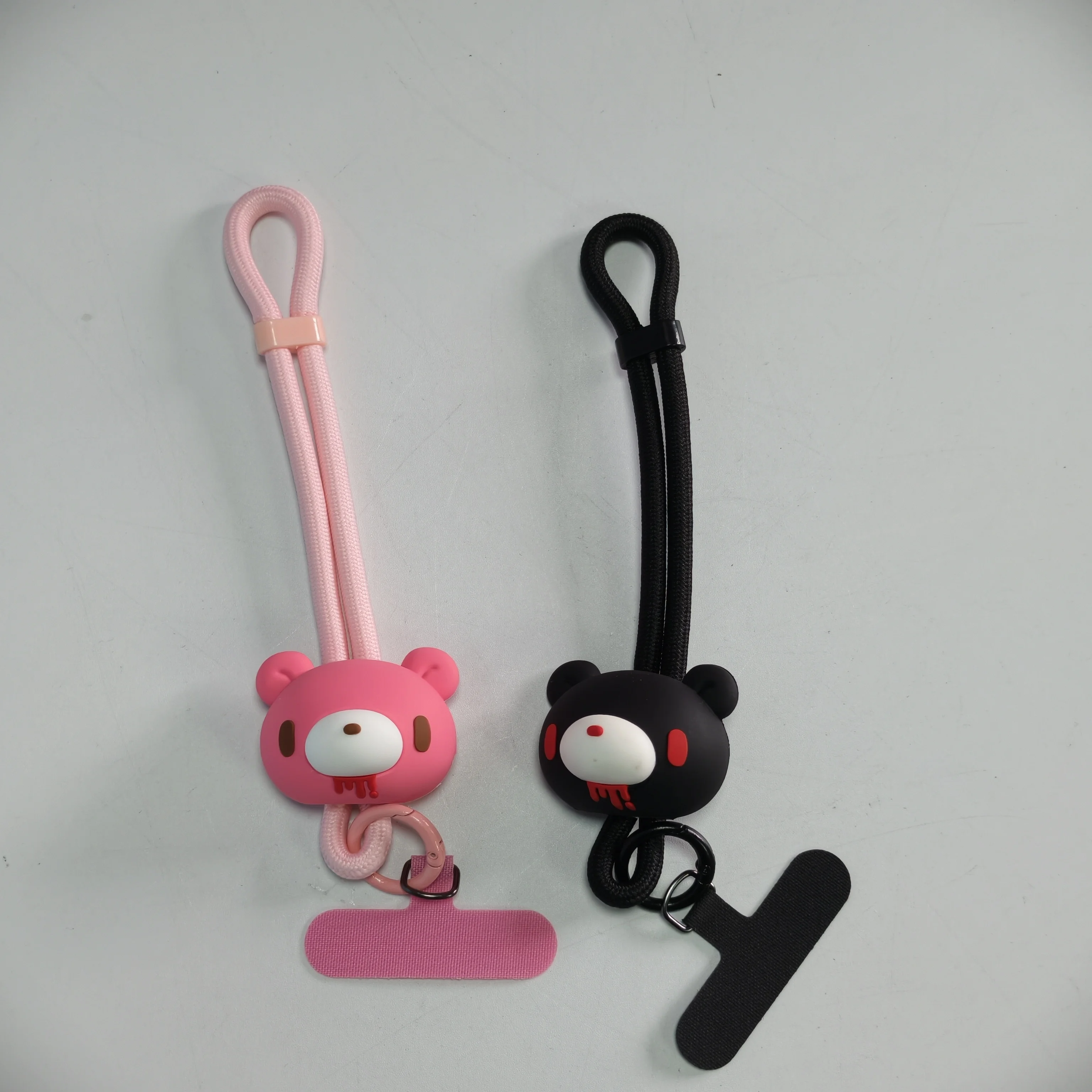 

cute Bear phone straps—Black/pink rubber straps with cute Bear charms. Add a sweet - edgy flair to your device.