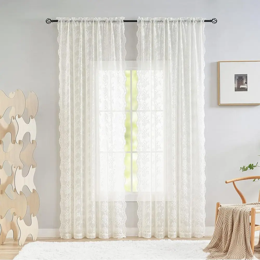 Close-up of the delicate branch pattern on the ivory sheer curtains