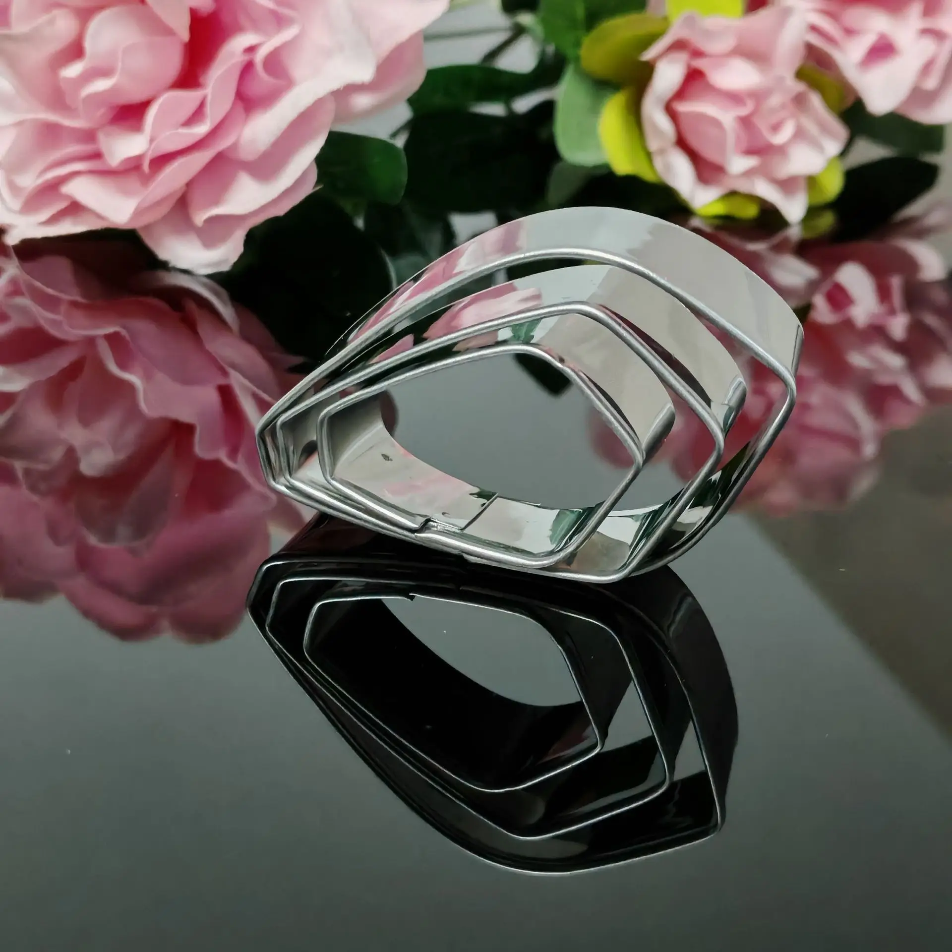 Food-safe stainless steel floral cutter set featuring gardenia-shaped petal templates for cake decorating and dessert crafting —