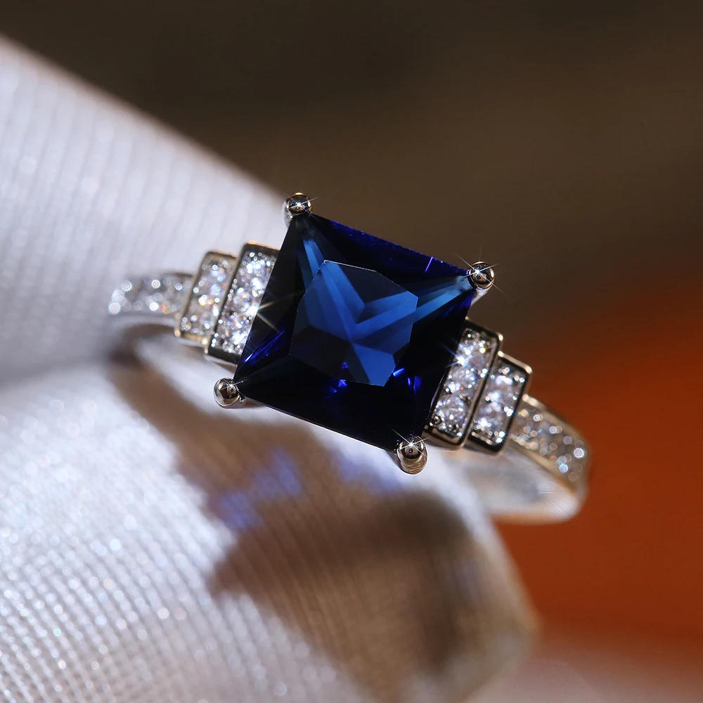 

Huitan Blue Square Cut Four Claws Women Ring Vintage Design Gracious Lady Luxury Inlaid Zircon Female Jewelry Wedding Hot Rings