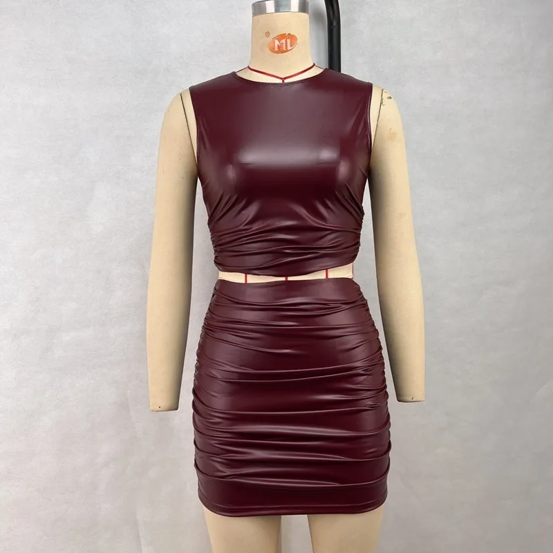 Conjunto de dos piezas de moda para mujer, minifalda de cuero PU, sin mangas, falda plisada de media longitud