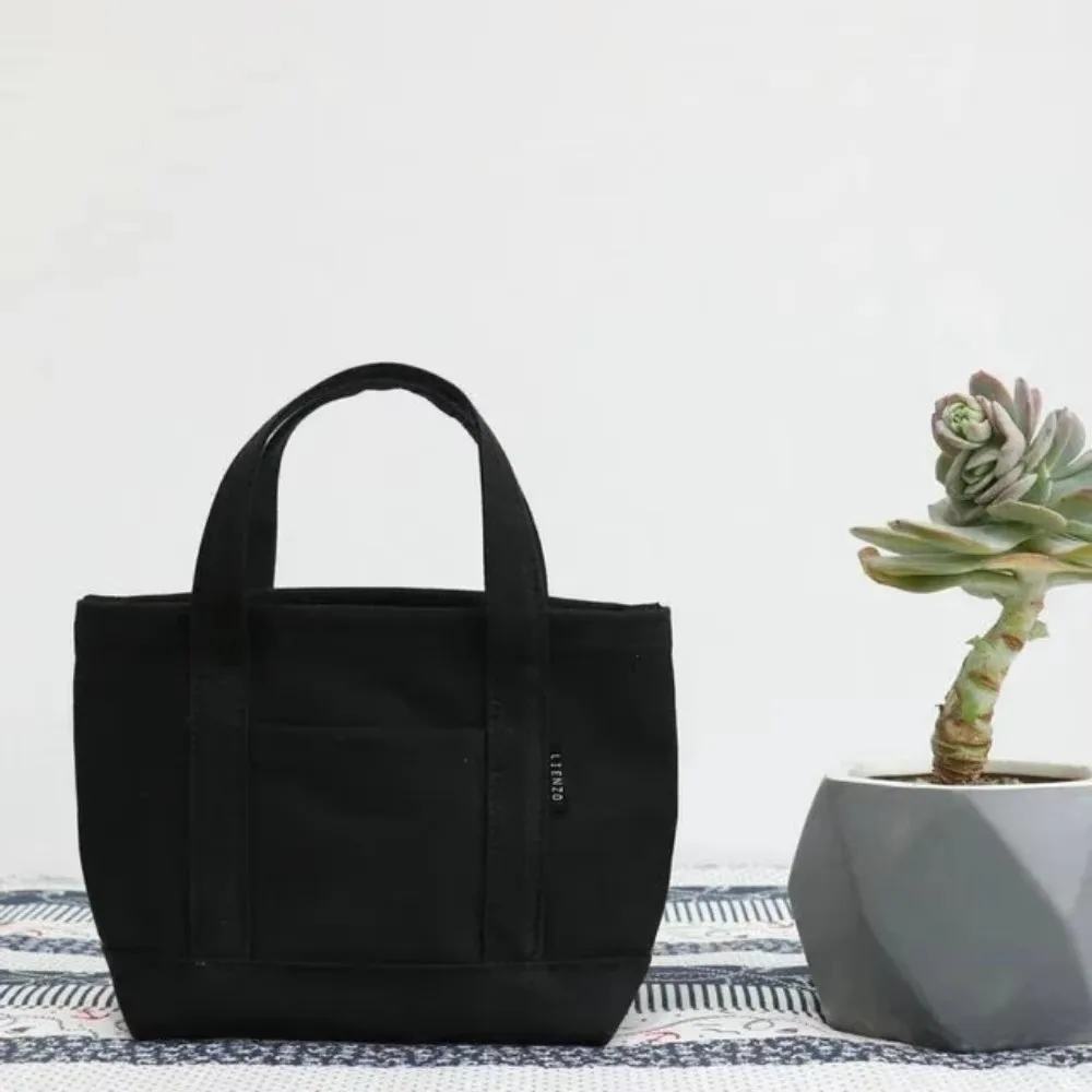 Nuevo Mini bolso de mano de lona de ocio, bolso pequeño Simple de diseñador coreano, bolso de compras para mujer, bolso de almuerzo