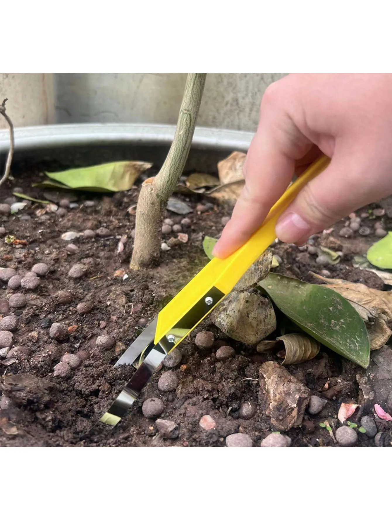 Durable Plastic Manual Weed Puller with V-Shaped Head, Effortless for Garden Weeding and Soil Removal.